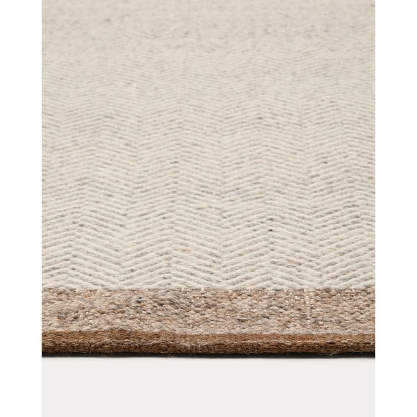 Béžový obojstranný ručne tkaný vlnený koberec 200x300 cm Nifelia – Kave Home-image-2